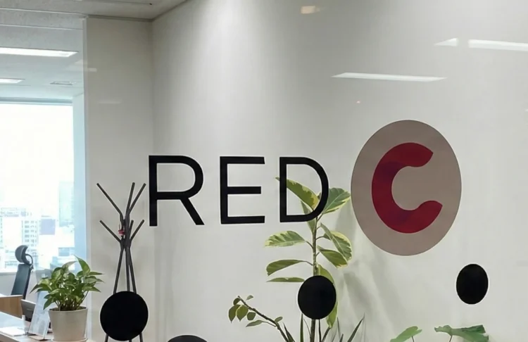Red C logo on a office glass door.