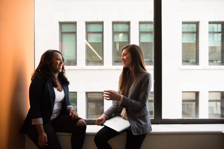 Two woman laughing.