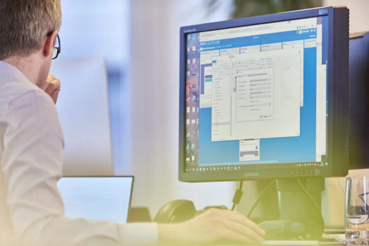 An image of a man using a computer.