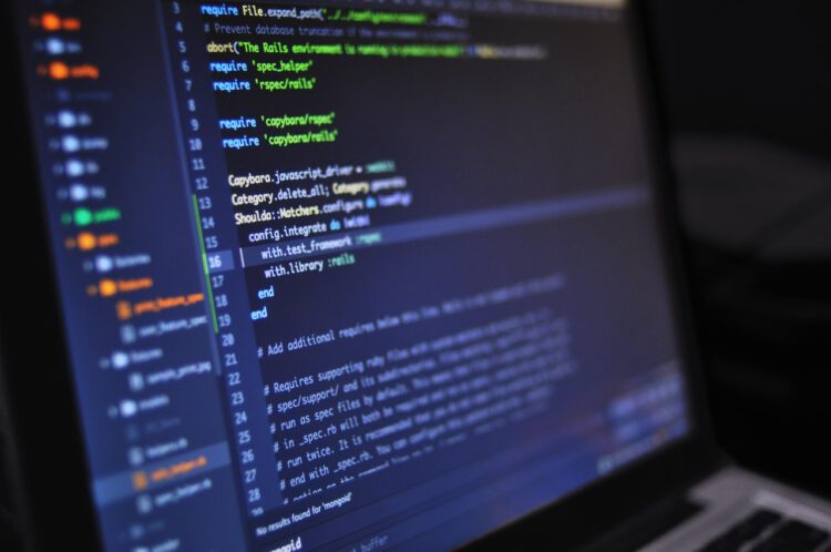 An image of a laptop displaying code.