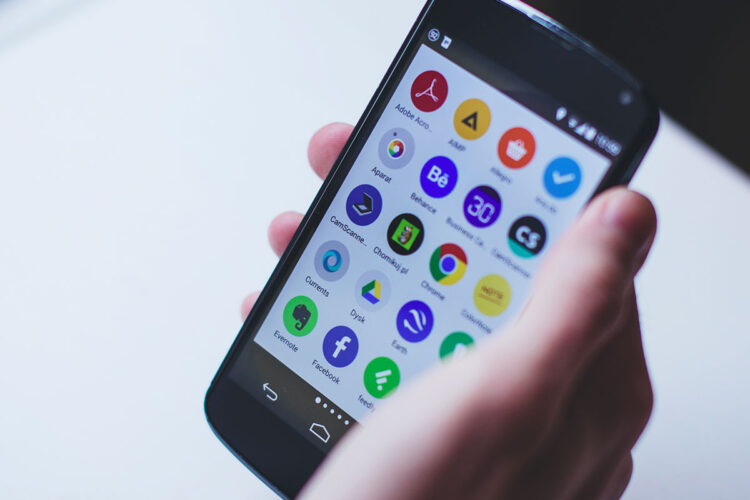 A close up shot of someone holding a phone.