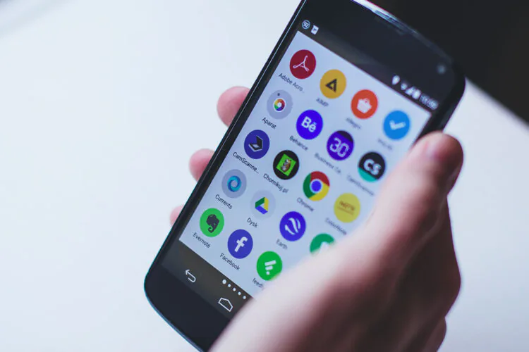 A close up shot of someone holding a phone.