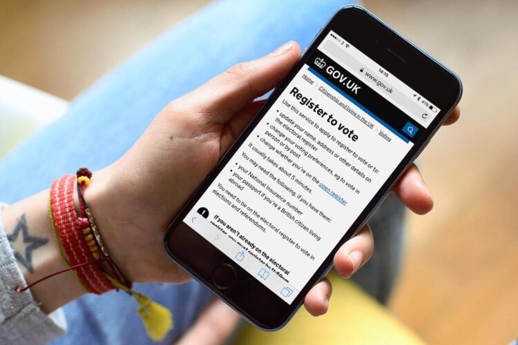An image of a person holding a phone displaying a 