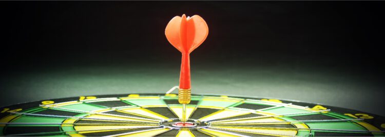 An image of a dart in the bullseye of a dart board.