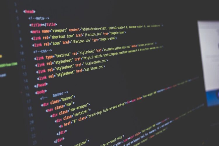 A close up shot of a computer screen displaying website code.