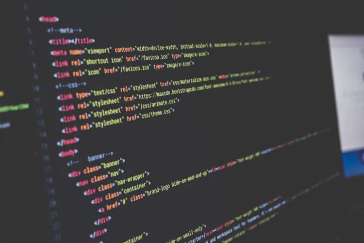 A close up shot of a computer screen displaying website code.