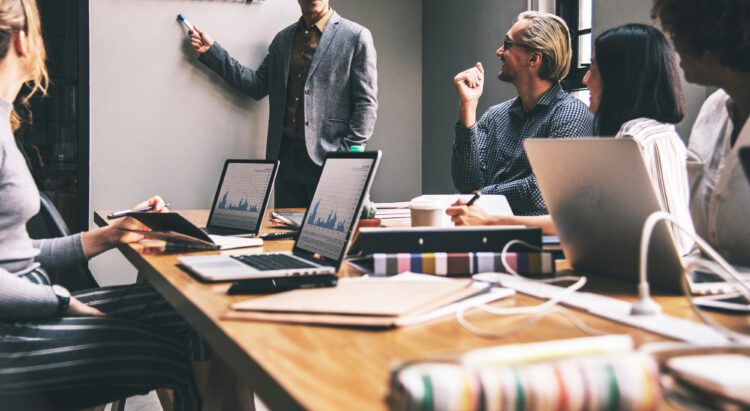 An image of a group of professionals in a meeting