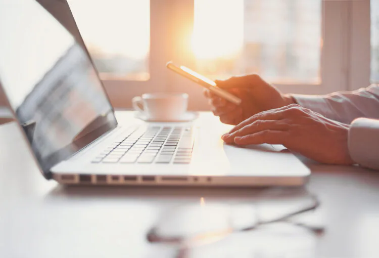 An image of a man using a laptop.