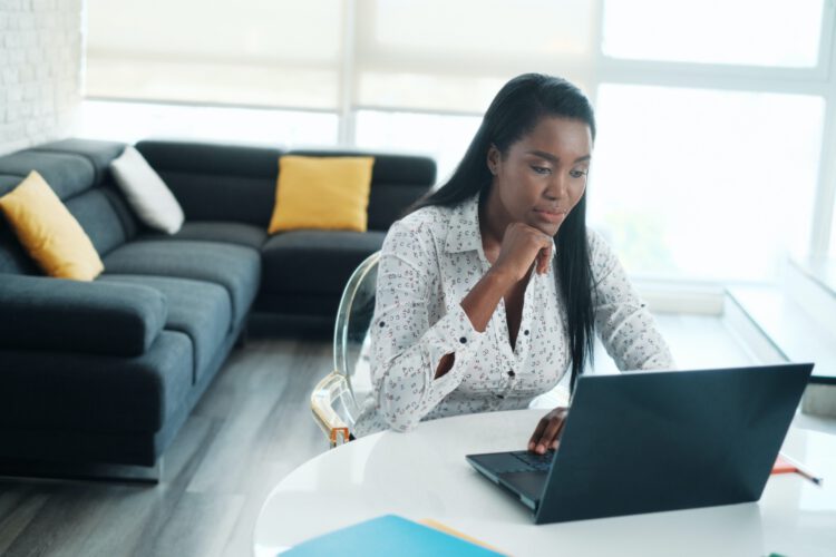 A woman using her laptop.