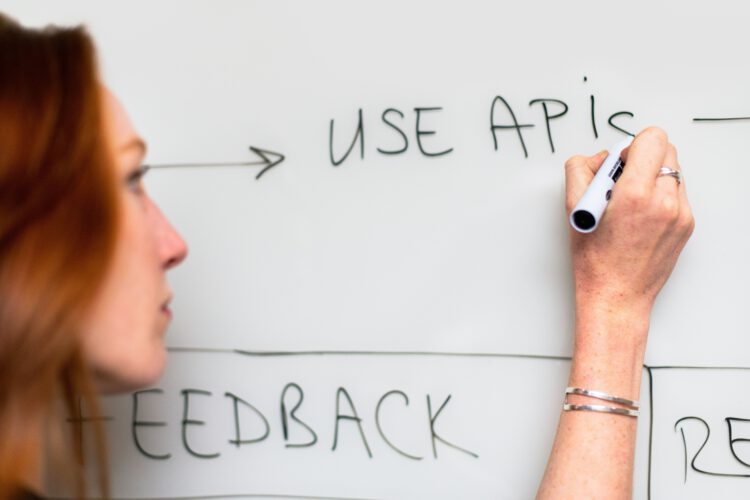 An image of a woman writing the word 