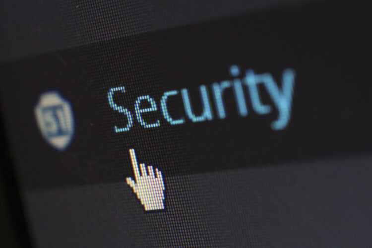 An image of a mouse hand clicking on the word security.