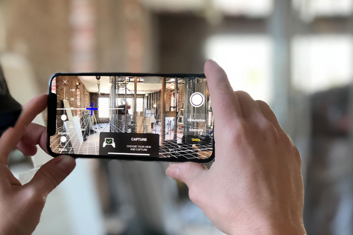 A phone scanning the room using its AR capabilities.