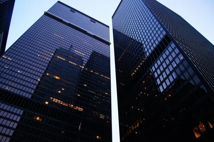 An image of two large, black skyscrapers.