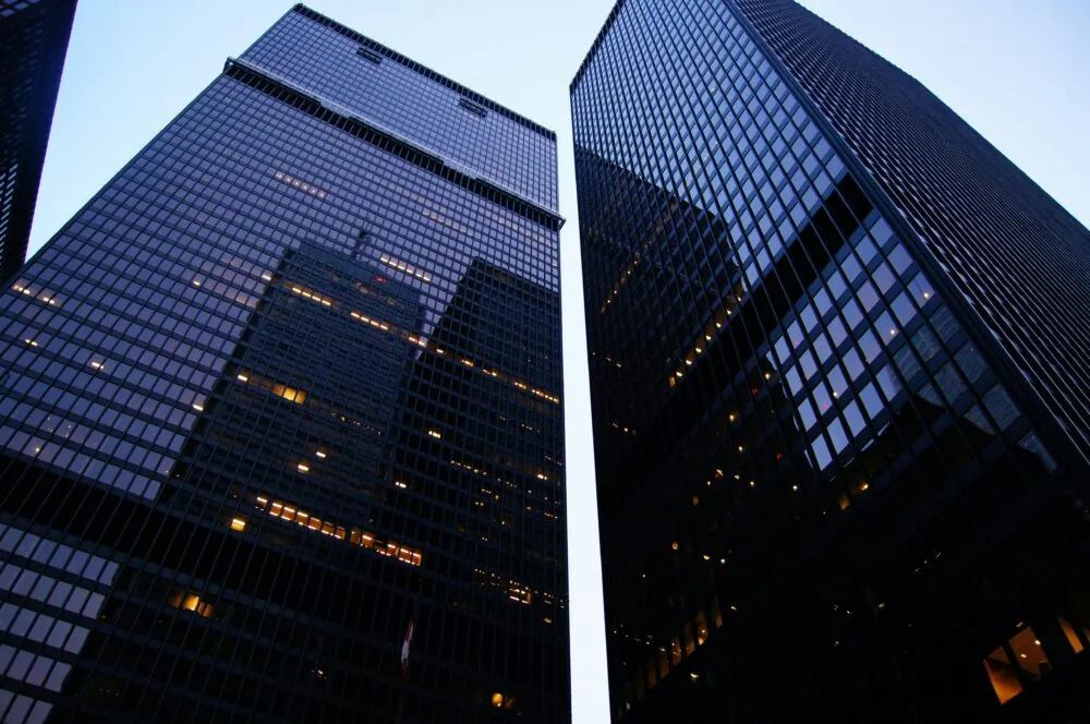 An image of two large, black skyscrapers.